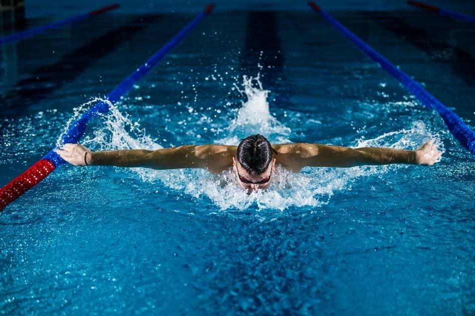 Woman doing water aerobics in a pool for weight loss