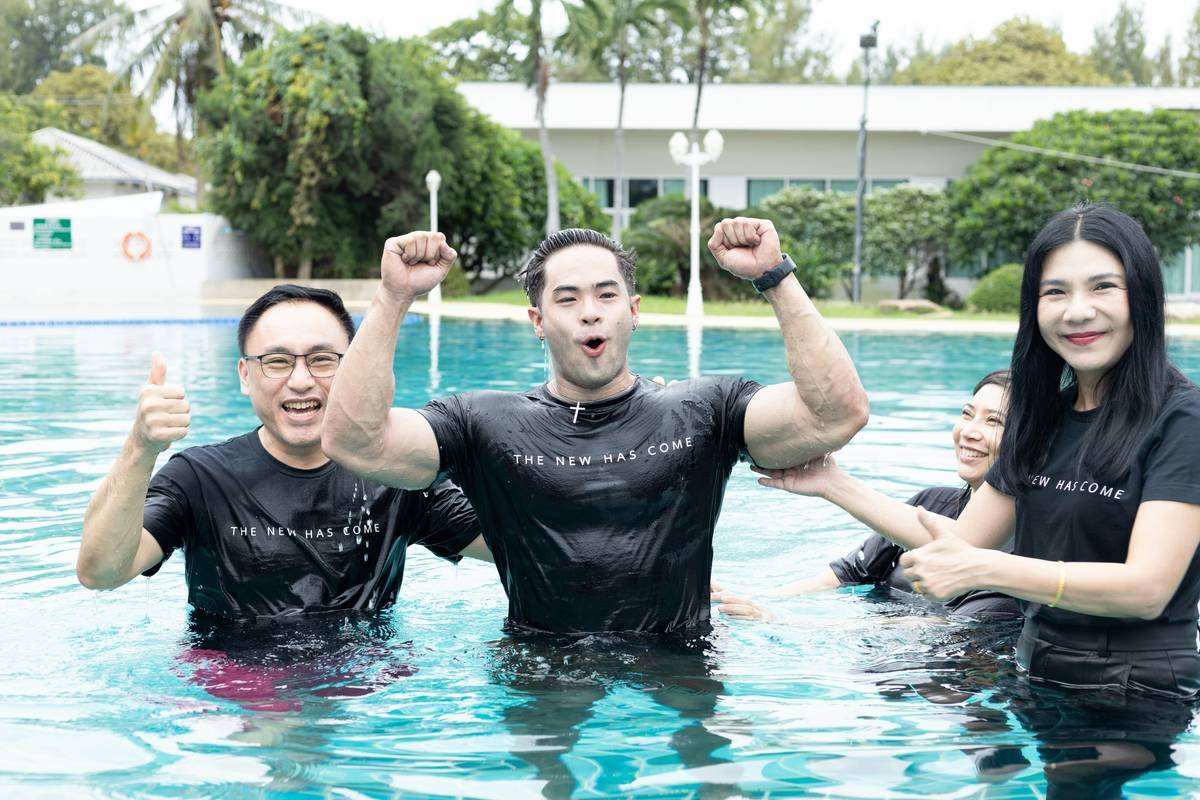 Woman performing swim slim water aerobic step by exercises in pool