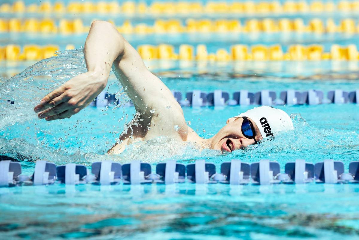 water aerobics health benefits: group of adults performing water aerobics in a pool with smiles